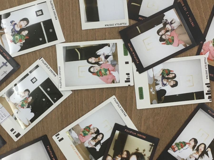 Scattered Instax photos with friends