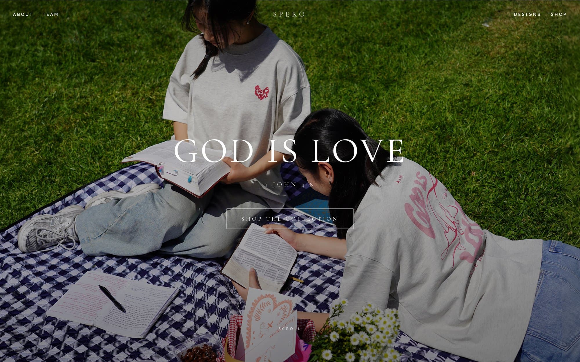 Spero site — God Is Love collection hero over a picnic photoshoot