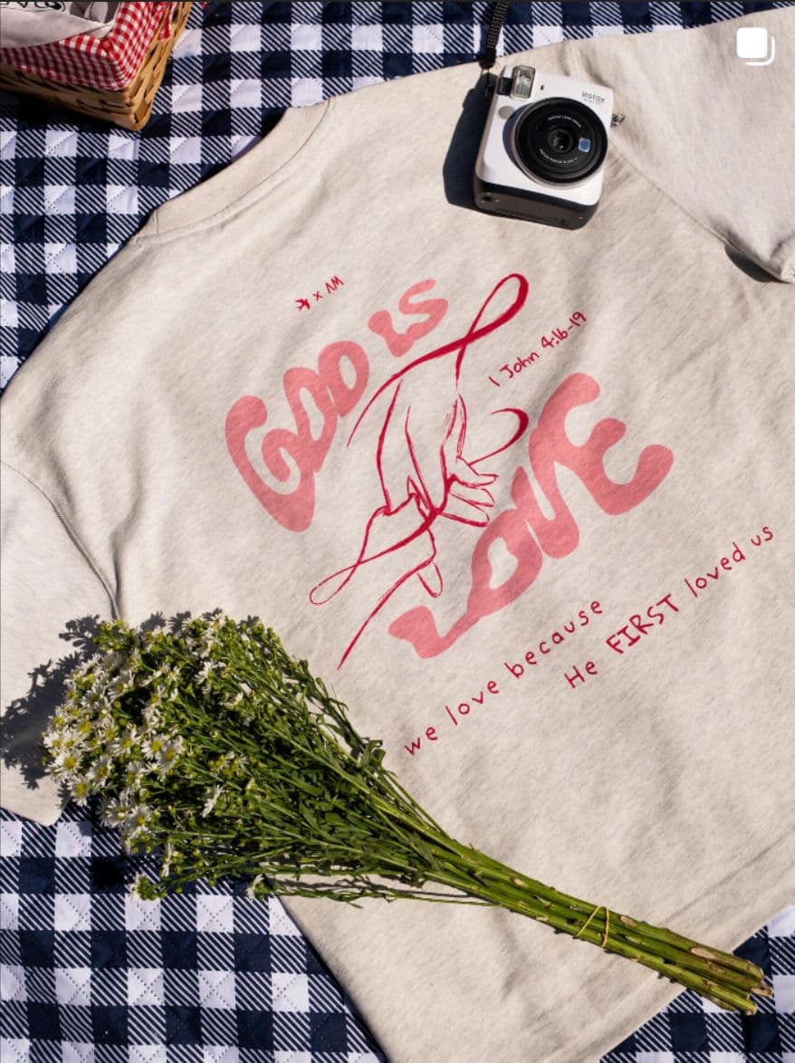 Spero Apparel Instagram — "God Is Love" sweatshirt flat lay